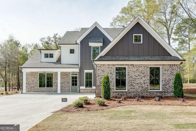 1241 Riverhill Dr, Bishop, GA 30621 - view of front facade featuring board and batten siding, brick siding, and a shingled roof
