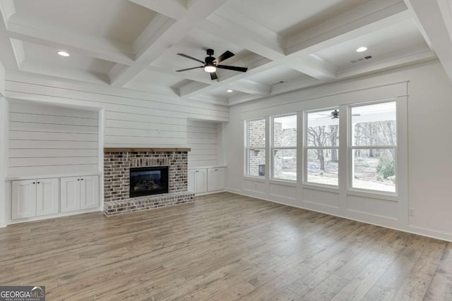 1241 Riverhill Dr, Bishop, GA 30621 - unfurnished living room featuring a ceiling fan, coffered ceiling, light wood-type flooring, beam ceiling, and a fireplace