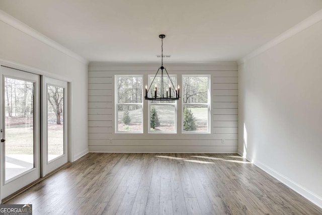 1241 Riverhill Dr, Bishop, GA 30621 - unfurnished dining area featuring a chandelier, hardwood / wood-style flooring, crown molding, and baseboards