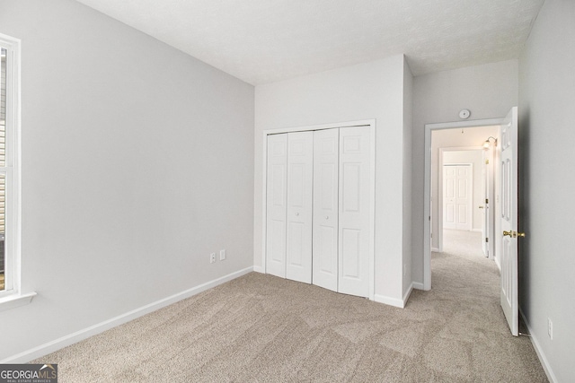 712 Brambling Way, Stockbridge, GA 30281 - unfurnished bedroom featuring carpet flooring and a closet