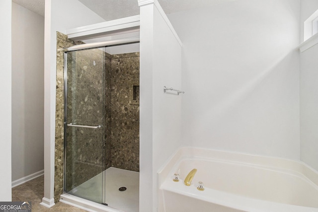 712 Brambling Way, Stockbridge, GA 30281 - bathroom with a garden tub and a shower stall