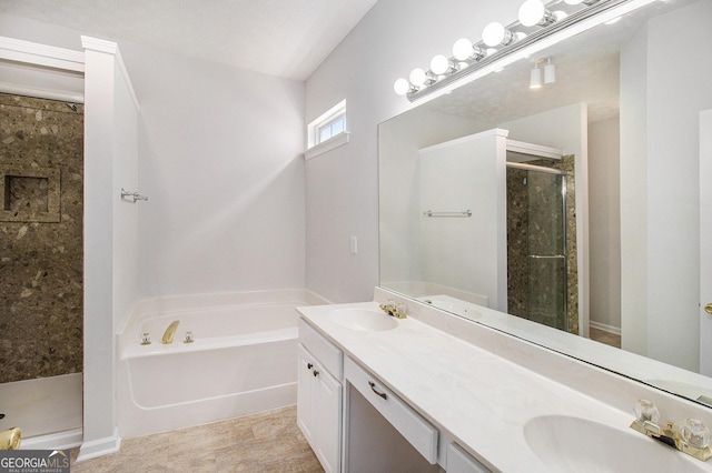 bathroom with a shower stall, a bath, and double vanity
