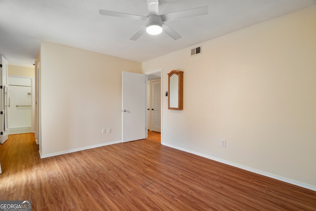 3301 Henderson Mill Rd Unit J1, Atlanta, GA 30341 - unfurnished room with wood finished floors, baseboards, and a ceiling fan