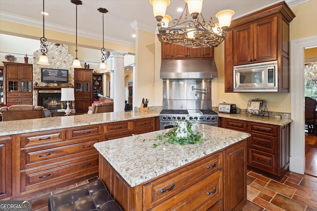19410 Ga Highway 169, Claxton, GA 30417 - kitchen featuring extractor fan, appliances with stainless steel finishes, ornamental molding, open floor plan, and light stone countertops