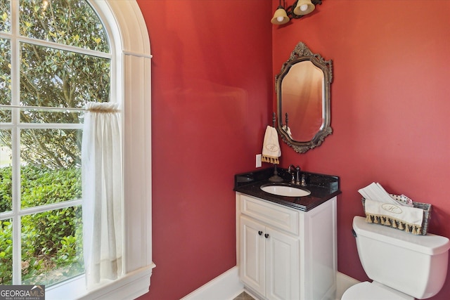 19410 Ga Highway 169, Claxton, GA 30417 - bathroom featuring toilet, vanity, and plenty of natural light
