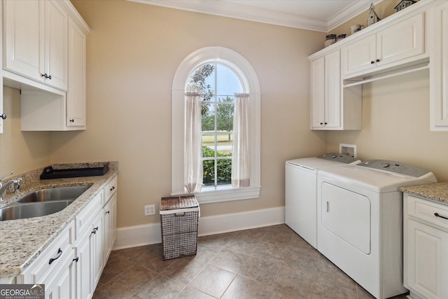 19410 Ga Highway 169, Claxton, GA 30417 - clothes washing area with washing machine and clothes dryer, cabinet space, crown molding, and baseboards