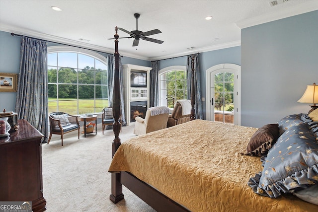 19410 Ga Highway 169, Claxton, GA 30417 - bedroom with carpet flooring, ornamental molding, access to exterior, a glass covered fireplace, and ceiling fan