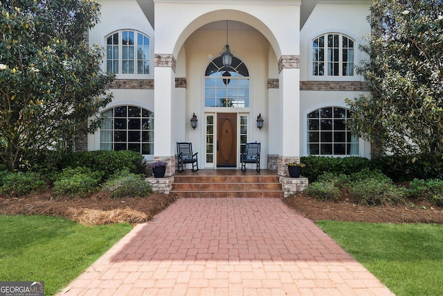 19410 Ga Highway 169, Claxton, GA 30417 - doorway to property featuring stone siding, stucco siding, and decorative driveway