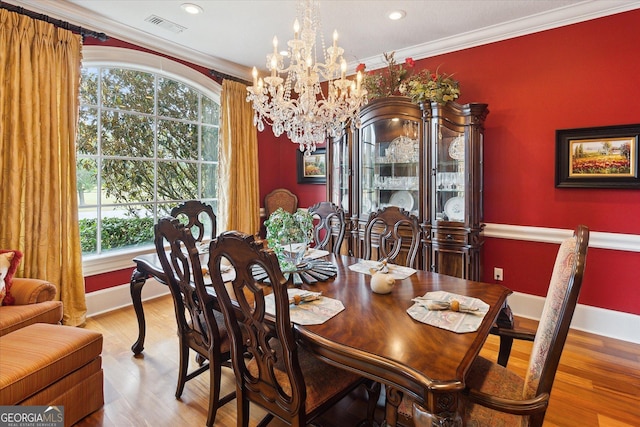 19410 Ga Highway 169, Claxton, GA 30417 - dining area with a chandelier, wood finished floors, crown molding, baseboards, and recessed lighting