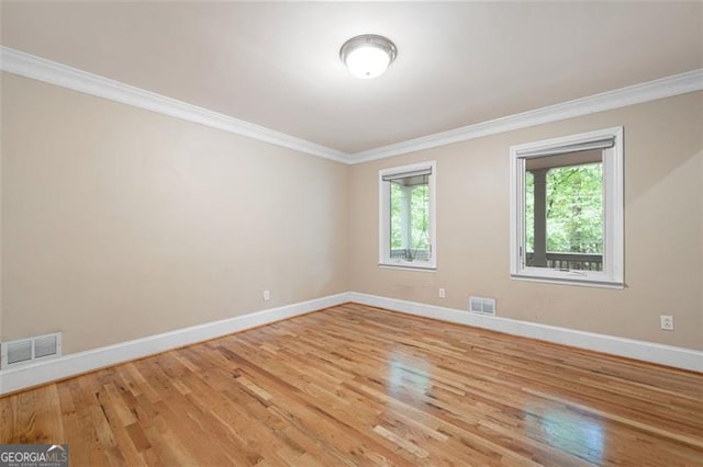 465 Willowbrook Dr, Smyrna, GA 30082 - spare room with baseboards, light wood-type flooring, and crown molding