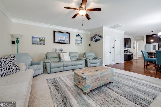 110 Bluegrass Cir, Guyton, GA 31312 - living area featuring ornamental molding, ceiling fan, wood finished floors, and arched walkways