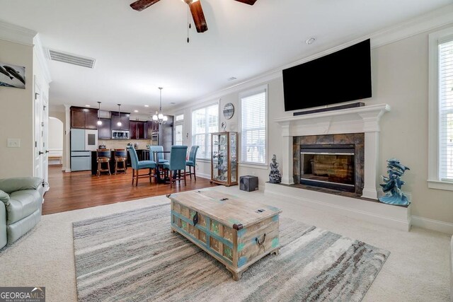 110 Bluegrass Cir, Guyton, GA 31312 - living room with ornamental molding, ceiling fan, a fireplace, baseboards, and recessed lighting