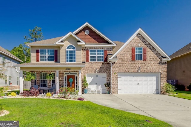 110 Bluegrass Cir, Guyton, GA 31312 - view of front of home featuring concrete driveway, brick siding, a front lawn, and covered porch