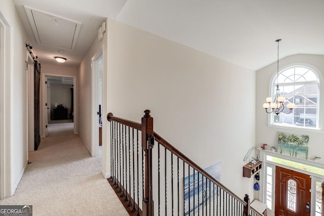 110 Bluegrass Cir, Guyton, GA 31312 - corridor with an upstairs landing, carpet floors, attic access, a chandelier, and lofted ceiling