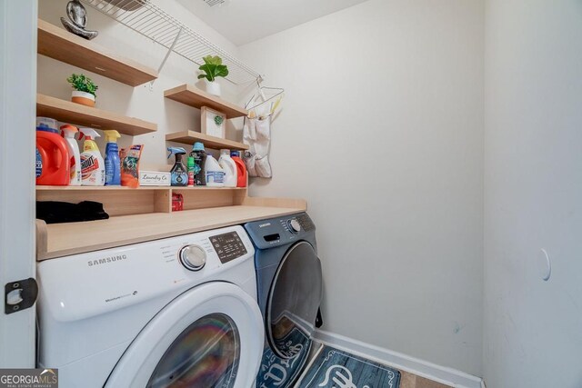 110 Bluegrass Cir, Guyton, GA 31312 - laundry room featuring washing machine and dryer and baseboards