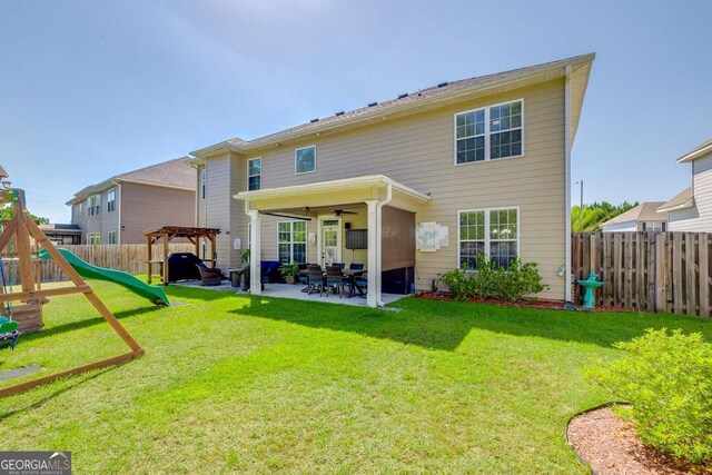 110 Bluegrass Cir, Guyton, GA 31312 - back of house with a playground, a patio, a ceiling fan, and a pergola