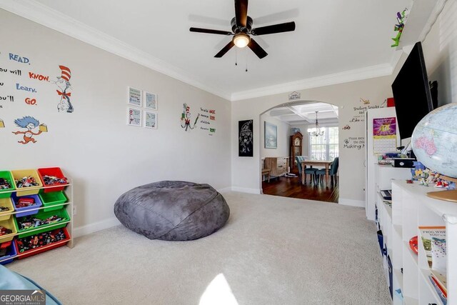 110 Bluegrass Cir, Guyton, GA 31312 - playroom featuring carpet floors, arched walkways, crown molding, a ceiling fan, and baseboards