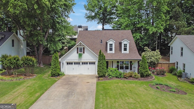 view of front facade featuring roof with shingles, driveway, a garage, cooling unit, and a chimney