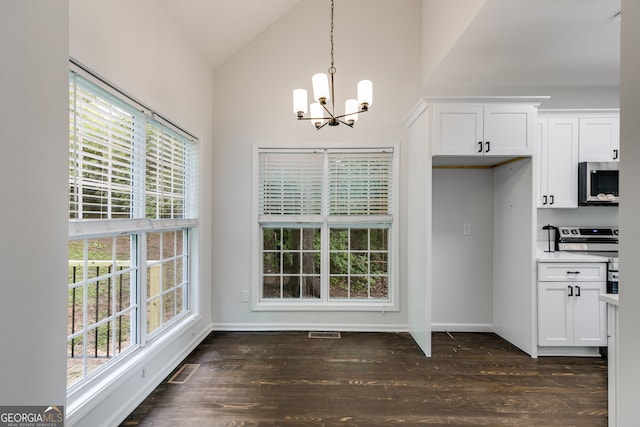 130 Opal Ln, Carrollton, GA 30116 - kitchen with stainless steel appliances, a chandelier, healthy amount of natural light, vaulted ceiling, and white cabinets