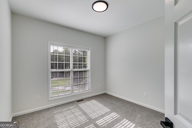 130 Opal Ln, Carrollton, GA 30116 - carpeted empty room featuring baseboards