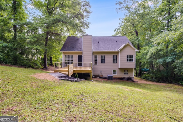 130 Opal Ln, Carrollton, GA 30116 - rear view of house featuring a chimney, a lawn, and a wooden deck
