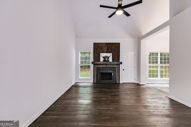 130 Opal Ln, Carrollton, GA 30116 - unfurnished living room featuring plenty of natural light, a ceiling fan, wood finished floors, a fireplace, and high vaulted ceiling