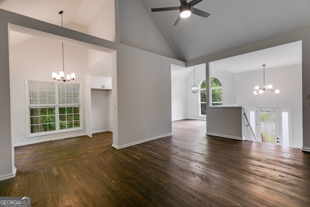 130 Opal Ln, Carrollton, GA 30116 - unfurnished living room with a chandelier, high vaulted ceiling, dark wood finished floors, a ceiling fan, and baseboards