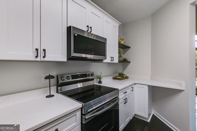 130 Opal Ln, Carrollton, GA 30116 - kitchen with appliances with stainless steel finishes, open shelves, white cabinetry, dark wood finished floors, and light stone counters