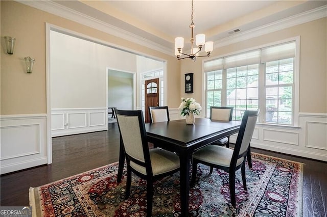 468 Scott Farm Dr, Powder Springs, GA 30127 - dining space featuring a chandelier, dark wood-style floors, a decorative wall, ornamental molding, and a wainscoted wall