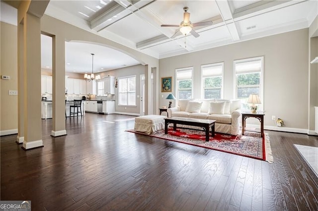 468 Scott Farm Dr, Powder Springs, GA 30127 - living area with dark wood-type flooring, a ceiling fan, a chandelier, beam ceiling, and baseboards