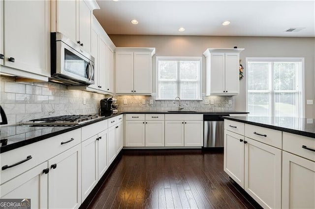 468 Scott Farm Dr, Powder Springs, GA 30127 - kitchen featuring stainless steel appliances, white cabinets, plenty of natural light, and recessed lighting