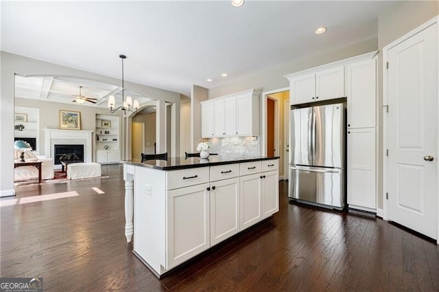 468 Scott Farm Dr, Powder Springs, GA 30127 - kitchen with freestanding refrigerator, dark countertops, white cabinets, dark wood-style floors, and ceiling fan
