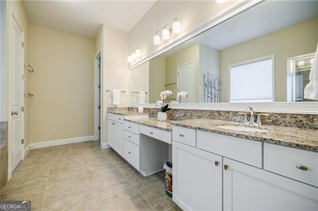 468 Scott Farm Dr, Powder Springs, GA 30127 - bathroom featuring double vanity, tile patterned flooring, and baseboards