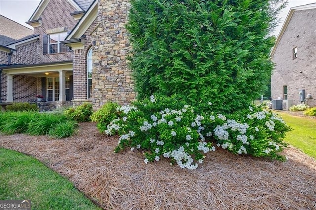 468 Scott Farm Dr, Powder Springs, GA 30127 - view of property exterior featuring brick siding, central AC unit, and stone siding