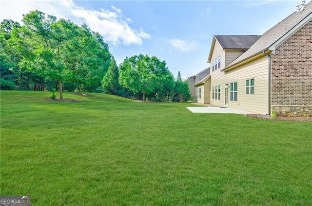 468 Scott Farm Dr, Powder Springs, GA 30127 - view of green lawn featuring a patio