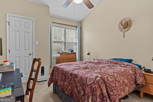 carpeted bedroom featuring lofted ceiling and ceiling fan