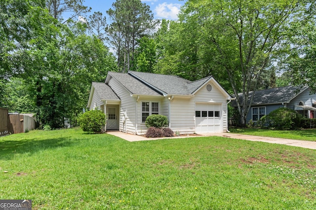 ranch-style home featuring a garage, driveway, and a shingled roof