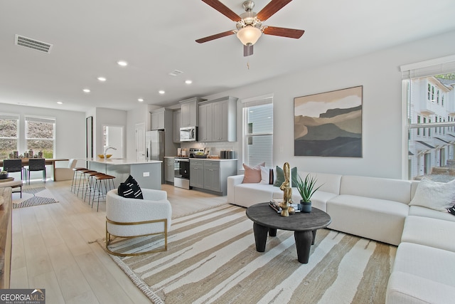 3142 Washburn St, Atlanta, GA 30354 - living area featuring light wood finished floors, ceiling fan, and recessed lighting
