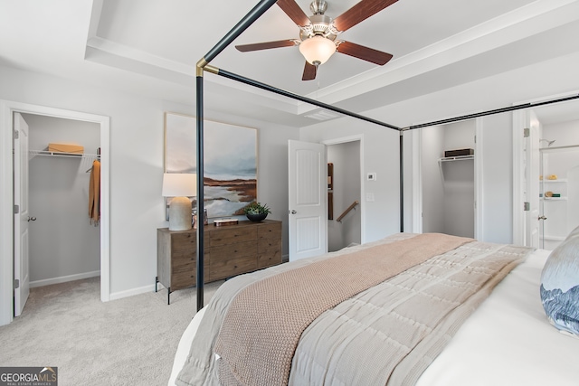 3142 Washburn St, Atlanta, GA 30354 - bedroom featuring a walk in closet, a closet, light colored carpet, baseboards, and a raised ceiling