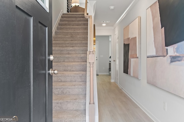 3142 Washburn St, Atlanta, GA 30354 - staircase featuring crown molding, wood finished floors, and baseboards