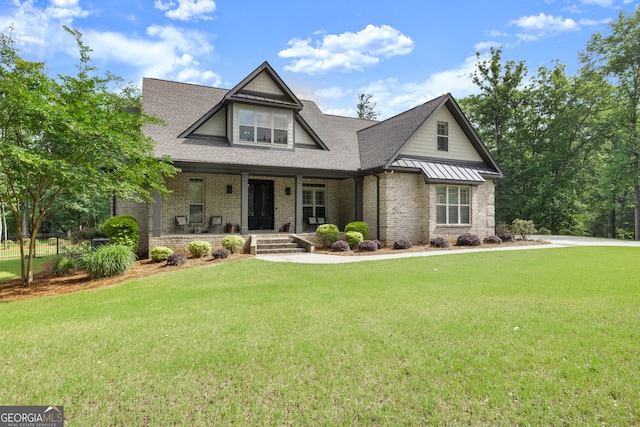 106 Chase Ln, Forsyth, GA 31029 - craftsman house featuring covered porch, a front lawn, and brick siding