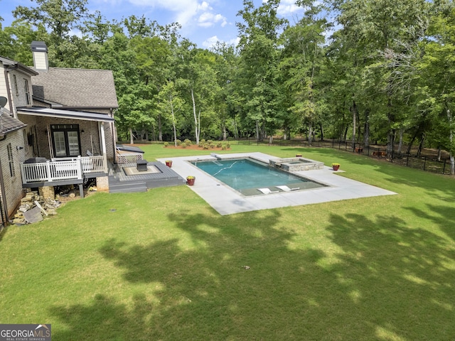 106 Chase Ln, Forsyth, GA 31029 - outdoor pool with an in-ground hot tub, a wooden deck, a fenced backyard, a diving board, and a patio area