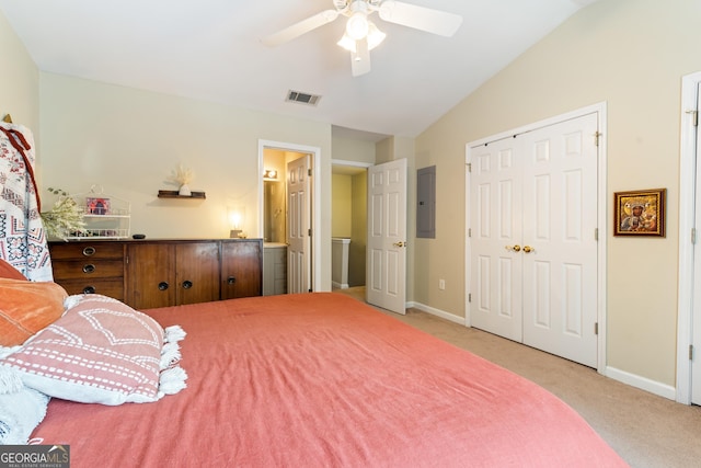 bedroom with electric panel, carpet floors, baseboards, vaulted ceiling, and a closet