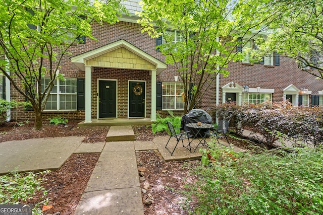 view of front of home featuring brick siding