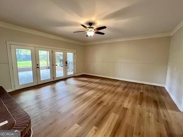 617 Smith St S, Bremen, GA 30110 - spare room with french doors, wood finished floors, crown molding, and baseboards