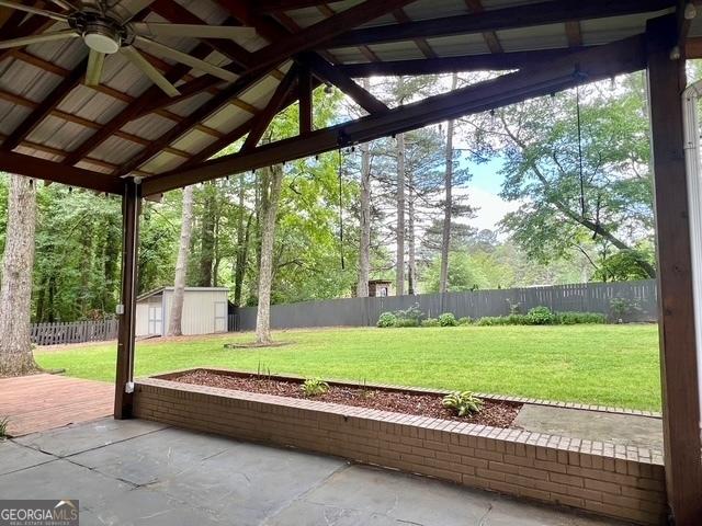 617 Smith St S, Bremen, GA 30110 - unfurnished sunroom featuring a ceiling fan and vaulted ceiling