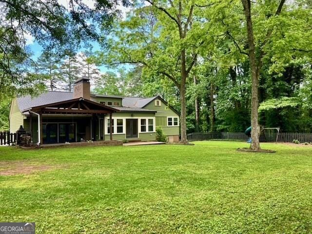 617 Smith St S, Bremen, GA 30110 - rear view of property featuring a chimney