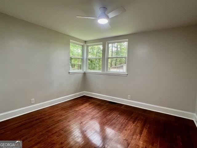 617 Smith St S, Bremen, GA 30110 - spare room with baseboards, a ceiling fan, and wood finished floors