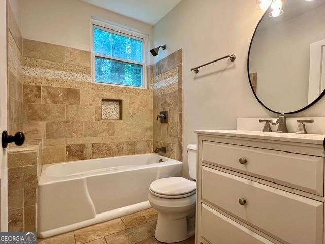 617 Smith St S, Bremen, GA 30110 - bathroom with toilet, shower / tub combination, and vanity