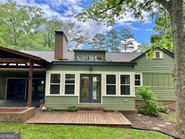 617 Smith St S, Bremen, GA 30110 - rear view of house with french doors and a chimney